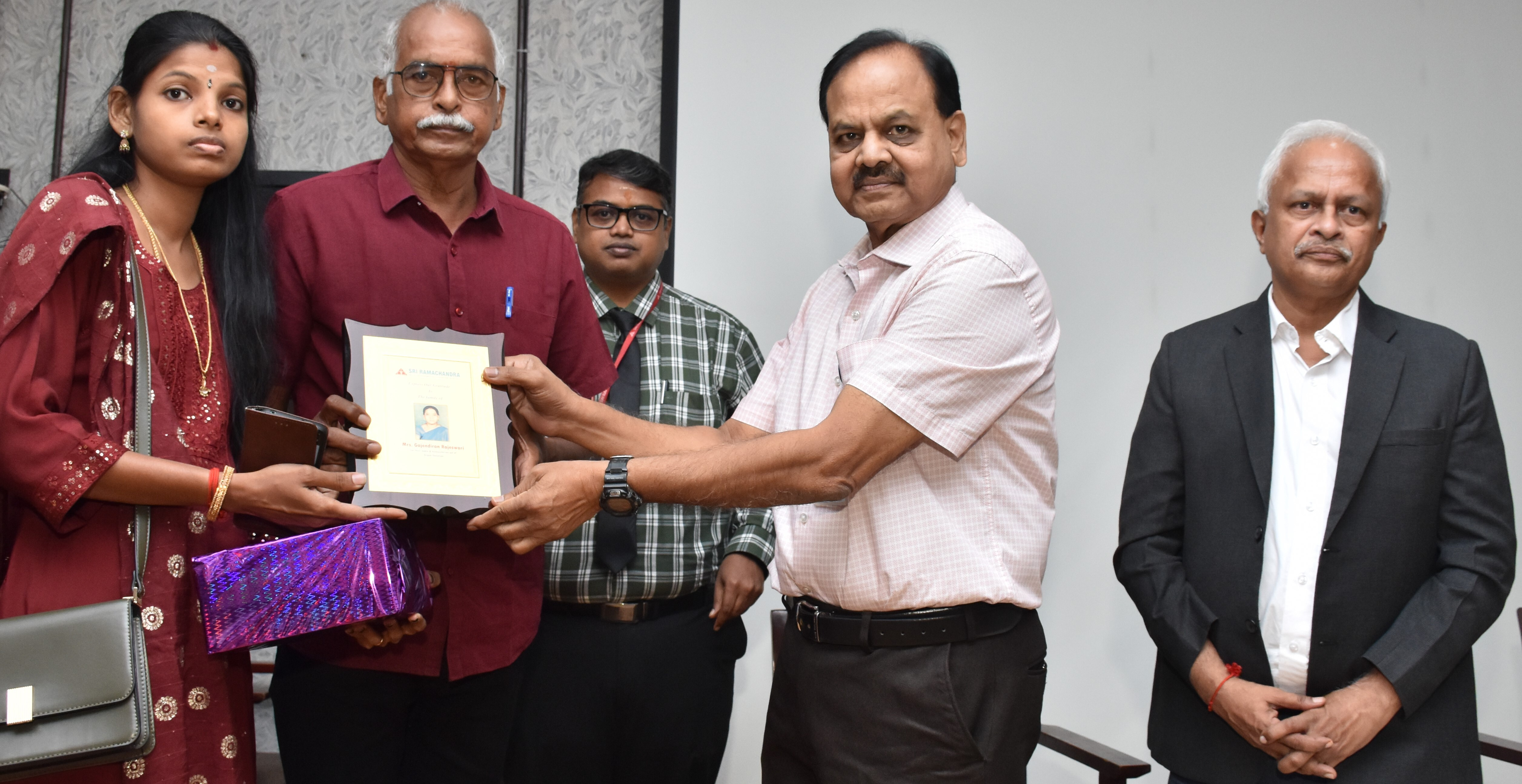 SRIHER Observed Tamil Nadu Organ Donation Day. Photo Shows Dr. M. Jayakumar, Professor, Nephrology Honoring the Family Members of a Brain Dead Person Who Donated Vital Organs