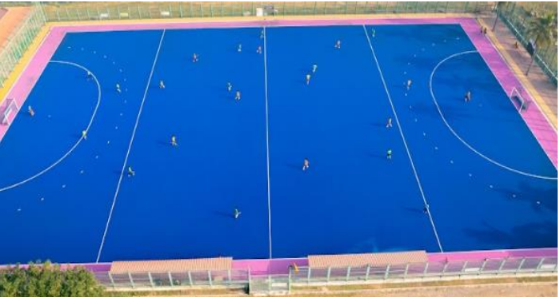 Field hockey players on turf
